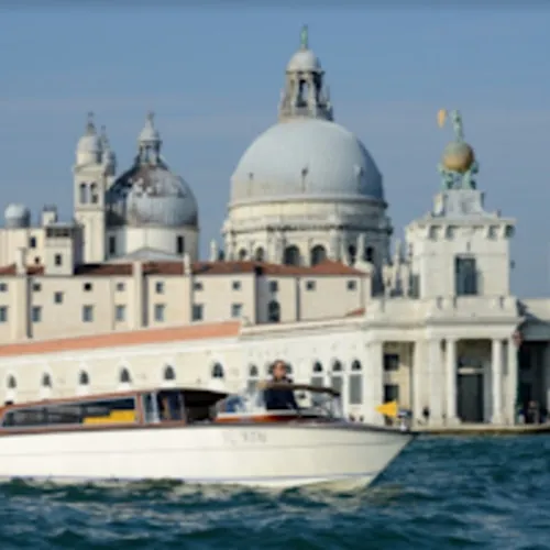 Water taxi and Santa Maria della Salute on a station transfer listing