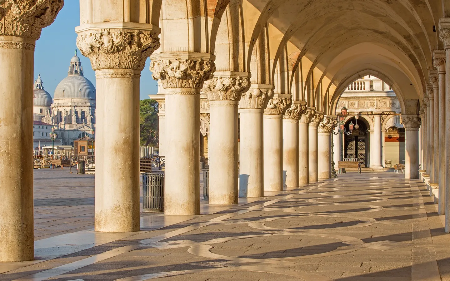 Arched colonnade of Doge’s Palace overlooking the waterfront