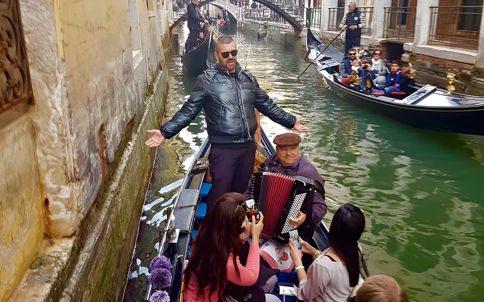 Gondola musicians performing on a Venetian canal