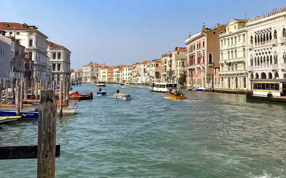 Grand Canal boats between waterfront palaces