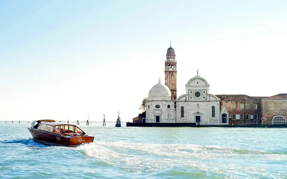 Private water taxi crossing the lagoon near San Giorgio Maggiore