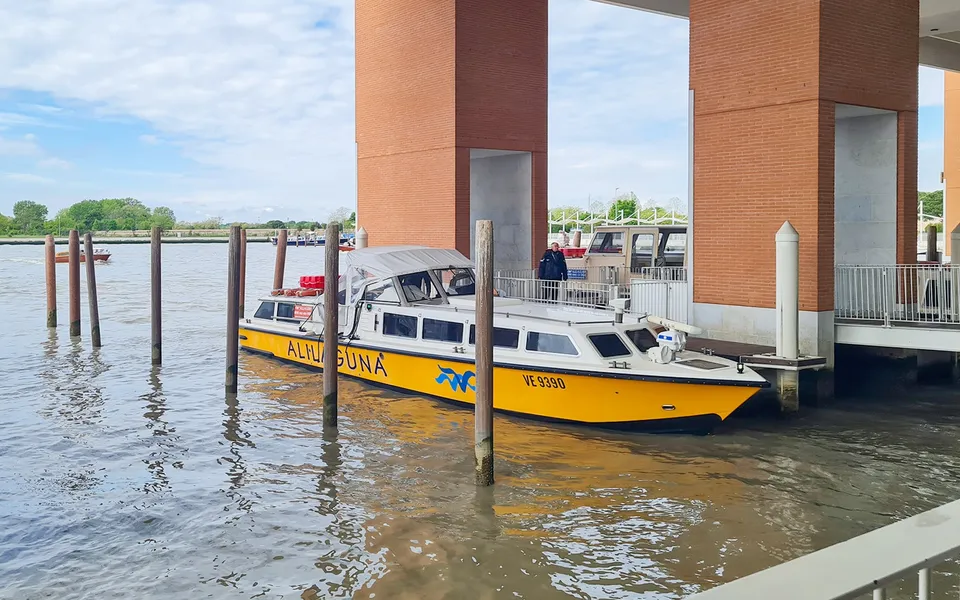 Alilaguna boats moored at the covered airport pier