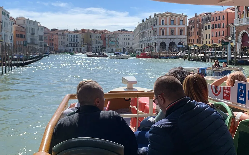 Water bus passengers looking along the Grand Canal